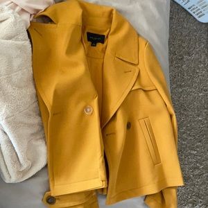 Like new. Umbrella coat sits at waist